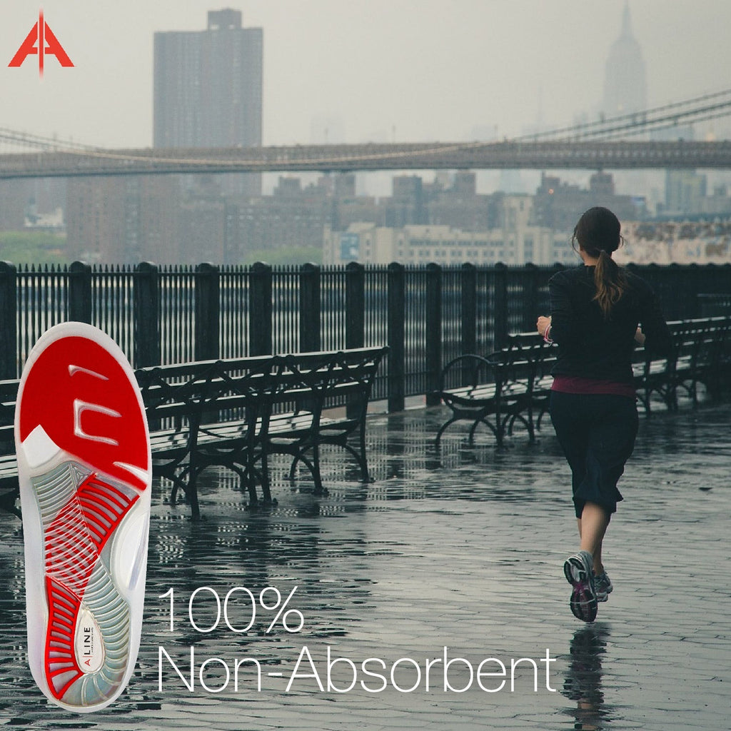 Runner jogging in wet conditions with ALINE Insoles 100% non-absorbent.